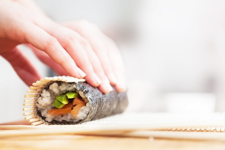 Experience the joy of crafting sushi rolls perfecting your knife skills and engaging with fellow food enthusiasts in a fun and interactive environment in Chicago.